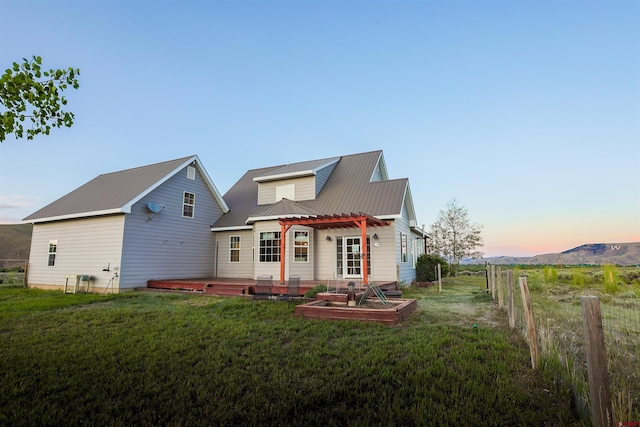 825 County Road 17, Gunnison, CO 81230 - rear view of house with a metal roof and a wooden deck