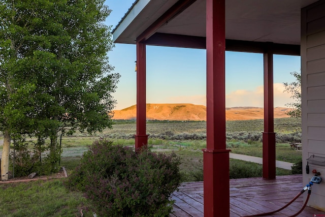 825 County Road 17, Gunnison, CO 81230 - deck at dusk with a mountain view and a view of countryside