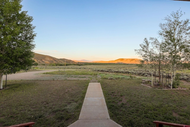 825 County Road 17, Gunnison, CO 81230 - view of green lawn featuring a mountain view and a view of countryside