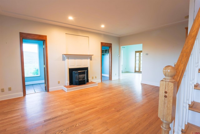 825 County Road 17, Gunnison, CO 81230 - unfurnished living room featuring light wood finished floors, stairs, recessed lighting, and a glass covered fireplace