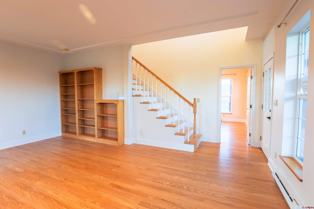 825 County Road 17, Gunnison, CO 81230 - entrance foyer with baseboard heating, stairway, and wood finished floors