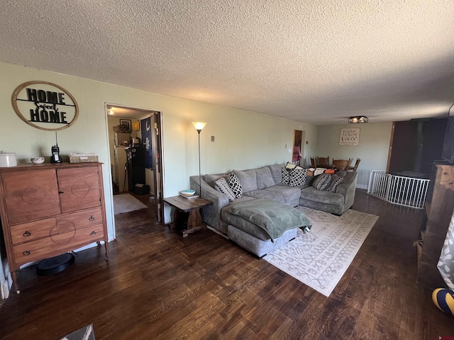 537 N Colorado Ave, Dove Creek, CO 81324 - living room with dark wood-style floors and a textured ceiling