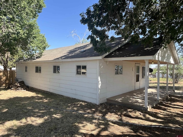 537 N Colorado Ave, Dove Creek, CO 81324 - view of side of property with a shingled roof