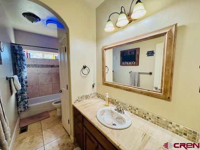 1490 SE Fairway Dr, Cedaredge, CO 81413 - full bathroom featuring vanity, shower / bath combo, and tile patterned floors