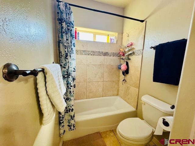 1490 SE Fairway Dr, Cedaredge, CO 81413 - full bath featuring shower / bath combo with shower curtain and toilet