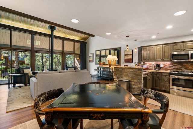 73 S Tamarron Dr Unit 822, Durango, CO 81301 - dining space featuring wood finished floors, recessed lighting, and high vaulted ceiling