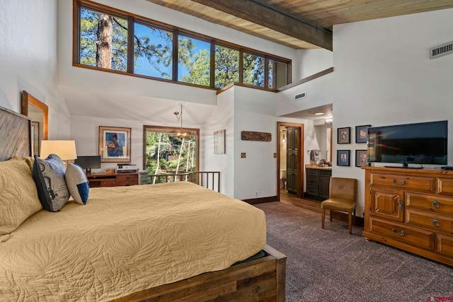 73 S Tamarron Dr Unit 822, Durango, CO 81301 - bedroom featuring carpet flooring, a high ceiling, wooden ceiling, and ensuite bath
