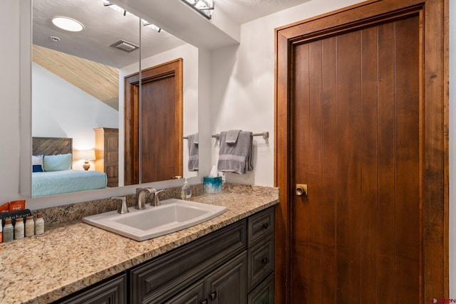 73 S Tamarron Dr Unit 822, Durango, CO 81301 - bathroom featuring vanity, connected bathroom, and lofted ceiling