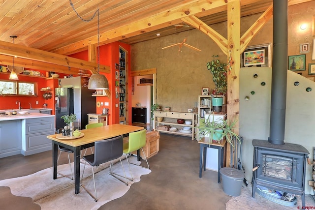 16242 Farmers Mine Rd, Paonia, CO 81428 - dining space featuring finished concrete flooring and a wood stove
