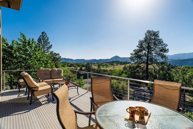 570 Jenkins Ranch Rd, Durango, CO 81301 - balcony featuring outdoor dining area, a mountain view, and an outdoor living space