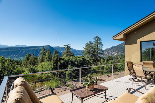 570 Jenkins Ranch Rd, Durango, CO 81301 - wooden deck with a mountain view and a wooded view
