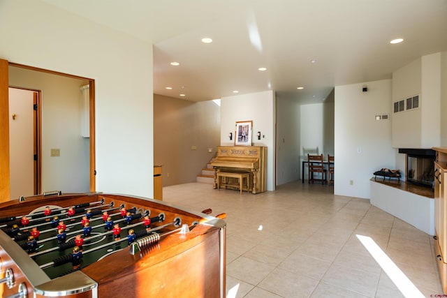 570 Jenkins Ranch Rd, Durango, CO 81301 - playroom featuring light tile patterned floors, recessed lighting, and a multi sided fireplace