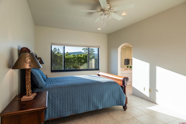 570 Jenkins Ranch Rd, Durango, CO 81301 - bedroom featuring arched walkways, light tile patterned flooring, recessed lighting, ensuite bathroom, and a ceiling fan