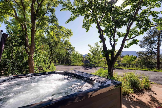 570 Jenkins Ranch Rd, Durango, CO 81301 - view of patio with a hot tub and a mountain view