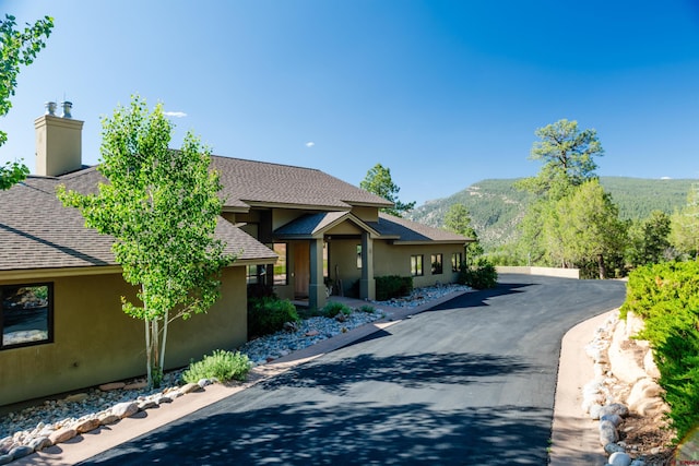 570 Jenkins Ranch Rd, Durango, CO 81301 - view of front of property with a shingled roof, stucco siding, and a mountain view