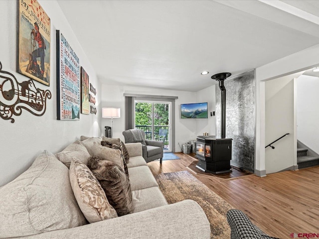1254 Champ Ln, Ouray, CO 81427 - living room featuring a wood stove, wood finished floors, stairs, and recessed lighting