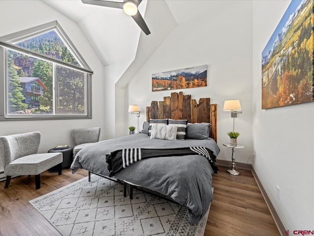 1254 Champ Ln, Ouray, CO 81427 - bedroom featuring wood finished floors, lofted ceiling, and ceiling fan
