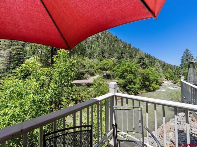 1254 Champ Ln, Ouray, CO 81427 - balcony featuring a forest view and a water view