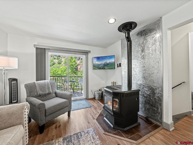 1254 Champ Ln, Ouray, CO 81427 - living room with a wood stove, wood finished floors, and recessed lighting