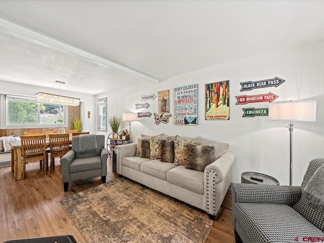 1254 Champ Ln, Ouray, CO 81427 - living room featuring wood finished floors, healthy amount of natural light, and beamed ceiling