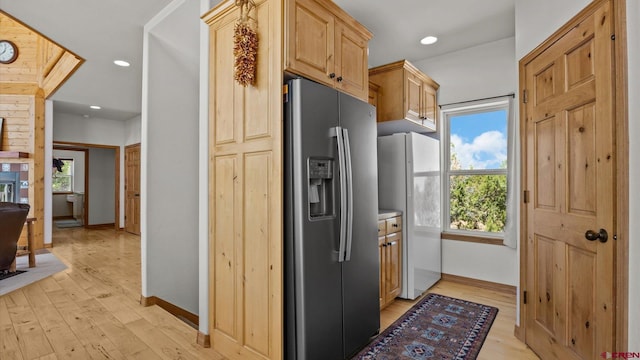 61850 V62 Trl, Montrose, CO 81403 - kitchen with stainless steel fridge, freestanding refrigerator, light wood-type flooring, light brown cabinetry, and plenty of natural light