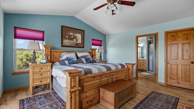 61850 V62 Trl, Montrose, CO 81403 - bedroom with vaulted ceiling, wood finished floors, ensuite bath, and a ceiling fan
