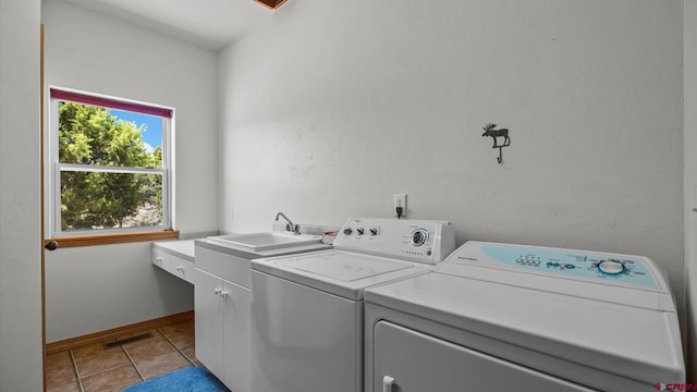61850 V62 Trl, Montrose, CO 81403 - laundry area featuring cabinet space, independent washer and dryer, and light tile patterned floors