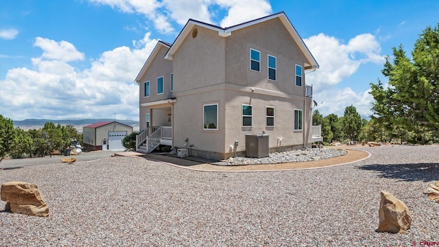 61850 V62 Trl, Montrose, CO 81403 - view of side of home featuring an outbuilding and stucco siding