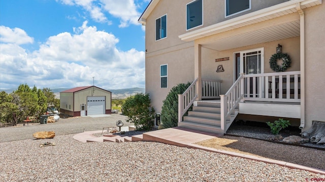 61850 V62 Trl, Montrose, CO 81403 - entrance to property with stucco siding and a detached garage
