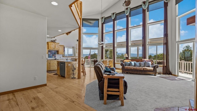 61850 V62 Trl, Montrose, CO 81403 - living room with a towering ceiling, light wood-style flooring, and recessed lighting