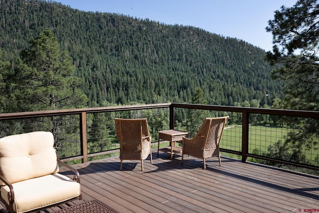 9 Los Ranchitos Dr, Durango, CO 81301 - wooden terrace featuring a view of trees and a mountain view