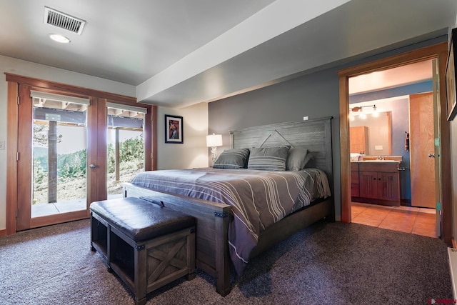 9 Los Ranchitos Dr, Durango, CO 81301 - bedroom featuring access to outside, light carpet, ensuite bathroom, and light tile patterned flooring