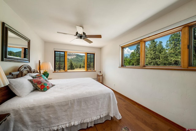 2415 Echo Canyon Ranch Ln, Pagosa Springs, CO 81147 - bedroom featuring wood finished floors and a ceiling fan
