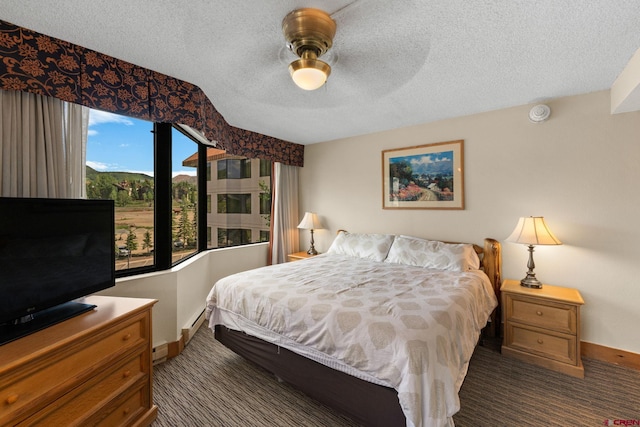 6 Emmons Road 452 & 454, Mount Crested Butte, CO 81225 - carpeted bedroom featuring a textured ceiling and ceiling fan