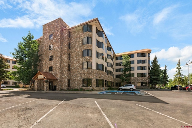6 Emmons Road 452 & 454, Mount Crested Butte, CO 81225 - view of building exterior featuring uncovered parking