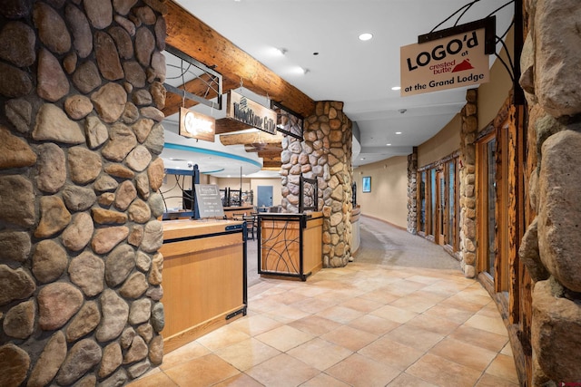 6 Emmons Road 452 & 454, Mount Crested Butte, CO 81225 - bar with decorative columns, recessed lighting, light carpet, and light tile patterned floors
