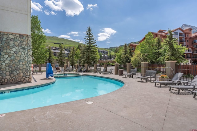 6 Emmons Road 452 & 454, Mount Crested Butte, CO 81225 - community pool featuring a patio area
