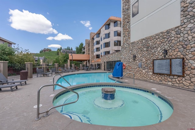 6 Emmons Road 452 & 454, Mount Crested Butte, CO 81225 - community pool with a patio area and a community hot tub