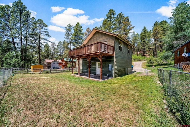 268 Forest Lakes Dr, Bayfield, CO 81122 - rear view of house with a wooden deck and a fenced backyard