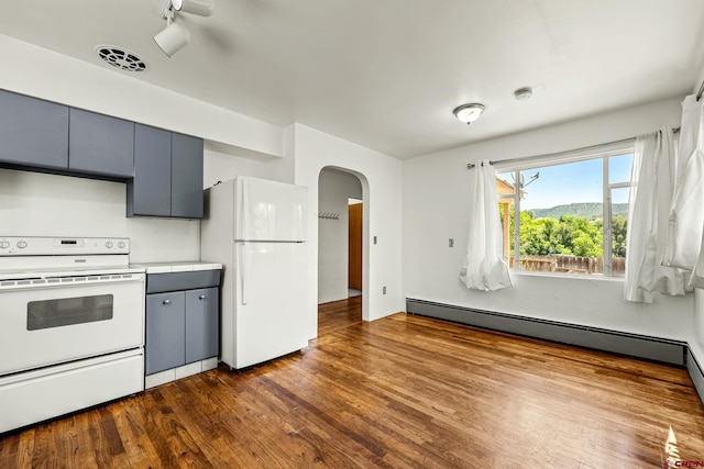 111 E 31st St, Durango, CO 81301 - kitchen featuring white appliances, arched walkways, dark wood finished floors, gray cabinets, and light countertops