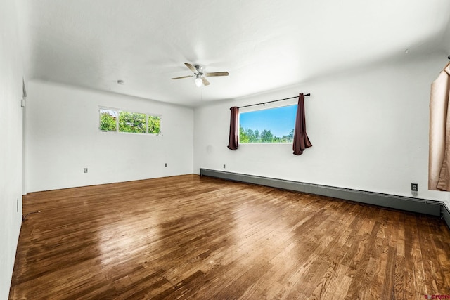 111 E 31st St, Durango, CO 81301 - empty room with ceiling fan, wood finished floors, and a baseboard heating unit