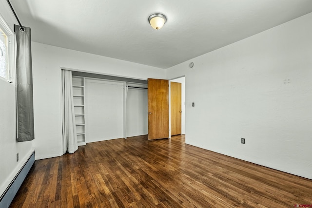 111 E 31st St, Durango, CO 81301 - unfurnished bedroom featuring a baseboard radiator, wood finished floors, and a closet
