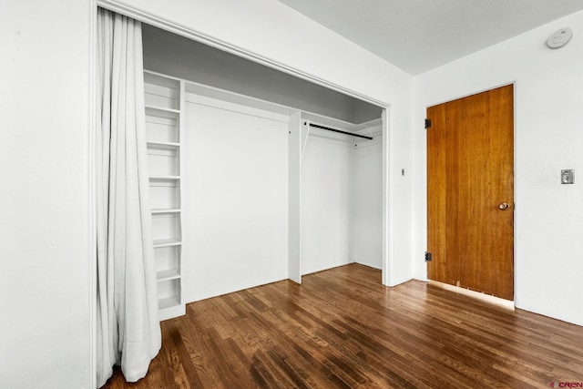111 E 31st St, Durango, CO 81301 - unfurnished bedroom featuring wood finished floors and a closet