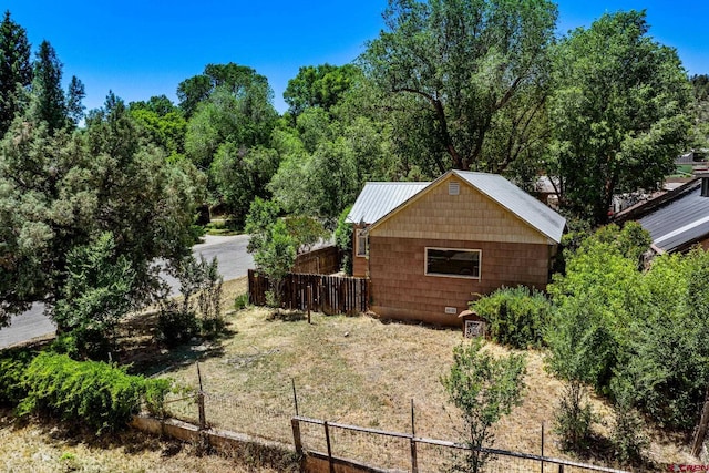 111 E 31st St, Durango, CO 81301 - view of side of home with a metal roof