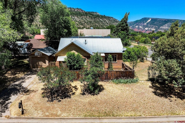111 E 31st St, Durango, CO 81301 - view of front of property with a garage, a metal roof, and a mountain view