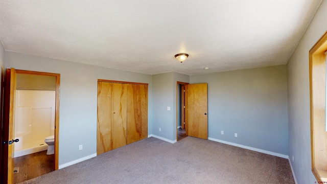 19029 Country Dr, Alamosa, CO 81101 - unfurnished bedroom with a closet, carpet, and connected bathroom