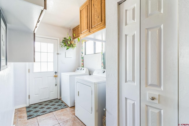 18796 Rd 25, Dolores, CO 81323 - laundry area with cabinet space, washer and clothes dryer, and light tile patterned flooring