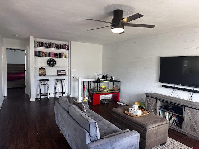431 Antelope Rd, Gunnison, CO 81230 - living room with ceiling fan, wood finished floors, a textured ceiling, and concrete block wall