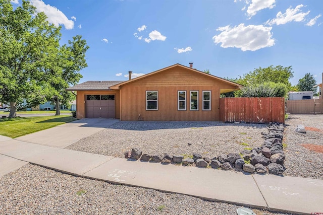2909 Pheasant Run St, Grand Junction, CO 81506 - ranch-style home with a garage and concrete driveway