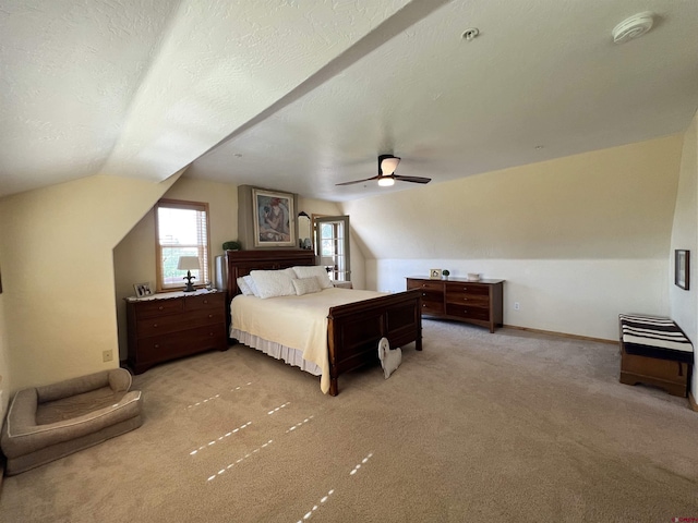 18173 Rd 22, Cortez, CO 81321 - carpeted bedroom featuring vaulted ceiling, ceiling fan, and a textured ceiling